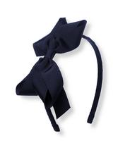 Accent her everyday looks with our pretty headband featuring a grosgrain ribbon bow. Polyester Grosgrain Ribbon; Plastic Headband. Spot Clean. Imported. Spot Clean; Imported. The Classics Shop.