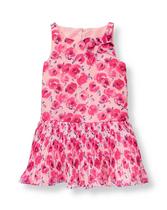 Vibrant floral print on swingy chiffon is perfect for parties. Dress is detailed with sweet pleats and permanent bow accent. 100% Polyester Chiffon. Fully Lined. Bloomer Included (Sizes Up To 18-24 Months). Keyhole Button Back. Machine Washable; Imported. Capri Pink.