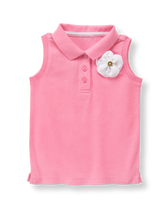 Preppy polo top in light cotton pique features a half-button placket and 3D bloom with gold-tone button accent. 100% Cotton Pique. Hem Vents. Machine Washable; Imported. Courtside Prep.