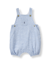 Ready for his first sail in our light linen blend. Features embroidered anchor on the bib pocket and adjustable shoulder straps. 55% Linen/45% Cotton. Side Buttons And Snaps Underneath. Back Pockets. Elasticized Cuffs. Machine Washable; Imported. Signature Layette.
