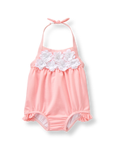 Make the sweetest splash with striped seersucker and 3D blooms. Halter silhouette is finished with pieced ruffles. 53% Polyester/41% Nylon/6% Spandex Seersucker. UPF 50+. Fully Lined. Clasp Halter With Permanent Bow. Machine Washable; Imported. Monaco Picnic.