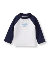 Give baby a sweet layer of sun protection for shore days. Raglan design features screenprinted whale. 80% Nylon/20% Spandex. Protective Swimwear. UPF 50+. Machine Washable; Imported. Monaco Picnic.