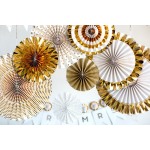 Fancy Party Pinwheels ~Elegant ivory dripping with gold foil is just what you need to dress up any event. Try clustering the paper pinwheels together on a wall