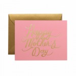 Pretty In Pink Mother's Day Greeting Card ~Folded card has a pink background with the gold foil script stamped phrase "Happy Mother's Day". Card is blank on the inside for your personal message and comes with a gold envelope.