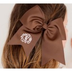 Brown Hair Bow ~Add a personal touch to an already picture perfect solid grosgrain hair bow. Bow features an alligator style clip and is personalized on the left tail. Put your girl's name on a hair bow today!  2.25" Alligator Clip Grosgrain Ribbon Monogram Shown: White Thread/Master Circle Font