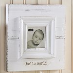 White Hello World Frame ~This white distressed wooden frame is enscribed with the saying "Hello world."