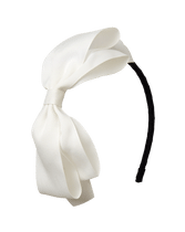 Accent her fancy look with our oversized bow headband in a versatile hue. Manmade Material. Spot Clean; Imported. Black & White Story.