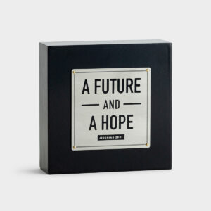 A Future and A Hope - Desk Plaque This sleek black and metal plaque is a great gift to encourage a loved one. The Future and Hope plaque is small enough to sit anywhere and adds a ray of God's light to any room.Message:A Future And A HopeJeremiah 29:11Product details:Inspirational plaqueSize: 4 3/4" x 4 3/4" x 1 1/2"Material: composite wood